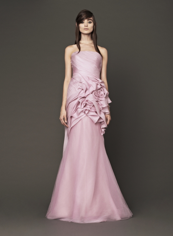 Vera Wang - Fall 2014 Bridal Collection - Wedding Dress Look 1
<br><br>
Petal strapless silk mermaid gown with organic flower detail accented by tulle hand draping and cascading bias cut silk organza flanges.
<br><br>
